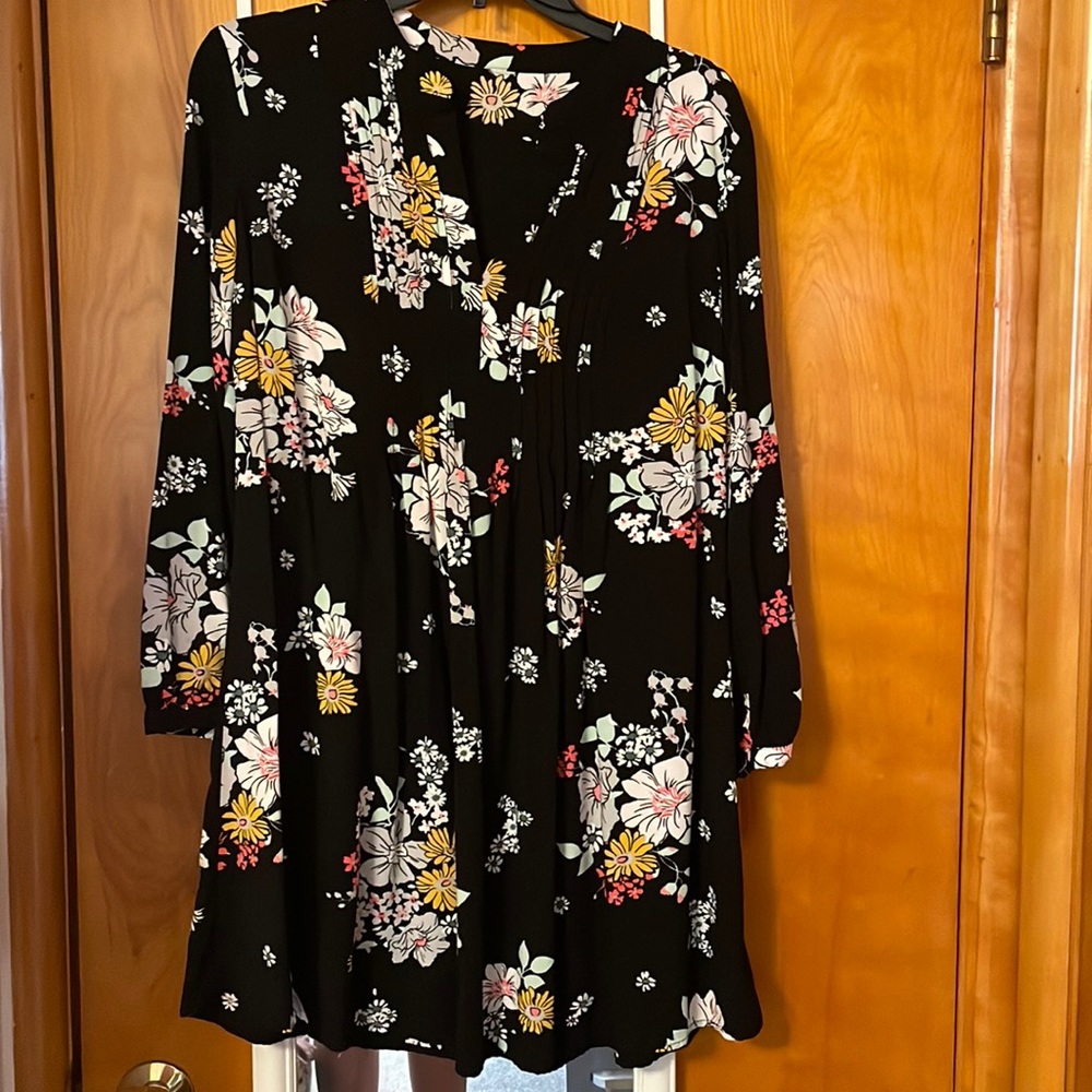 A black floral blouse, good condition, never worn